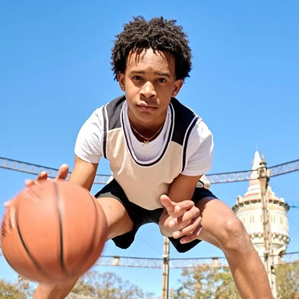 Student playing basketball