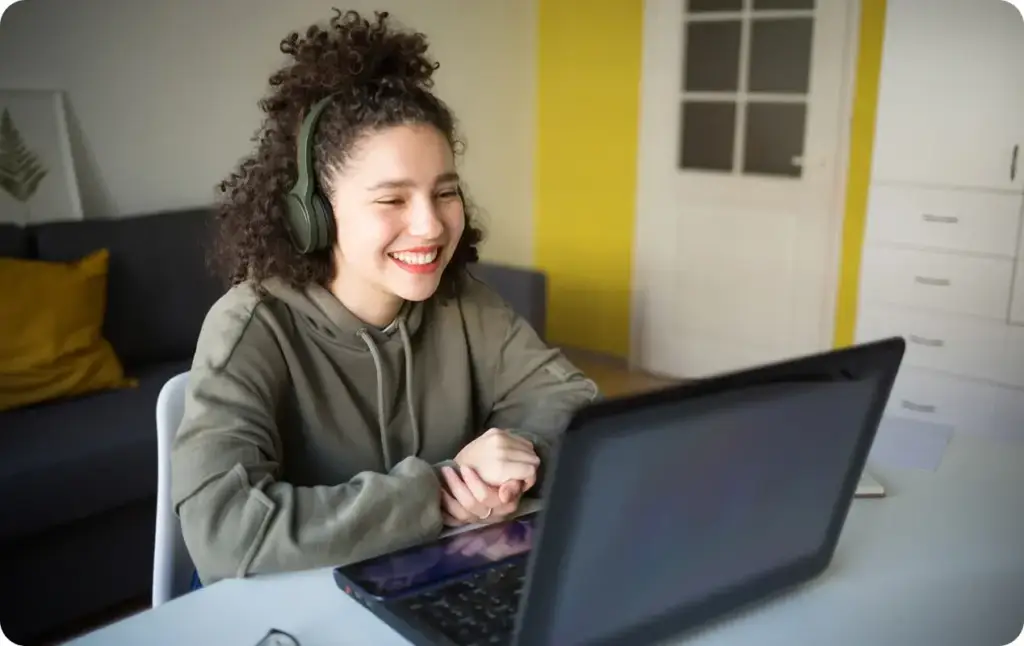 Student wearing a black pair of headphones